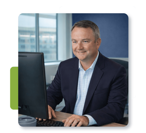 DDW President, Mike Freeman Working at a Computer DDW President, Mike Freeman Working at a Computer